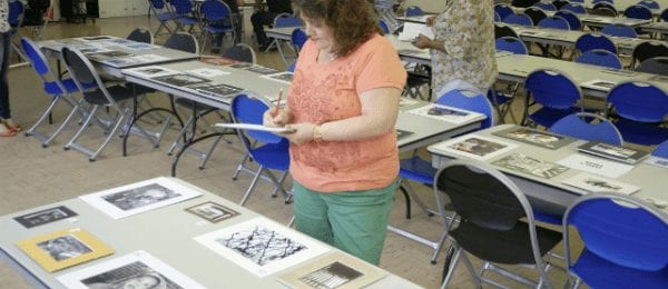 woman holding art piece